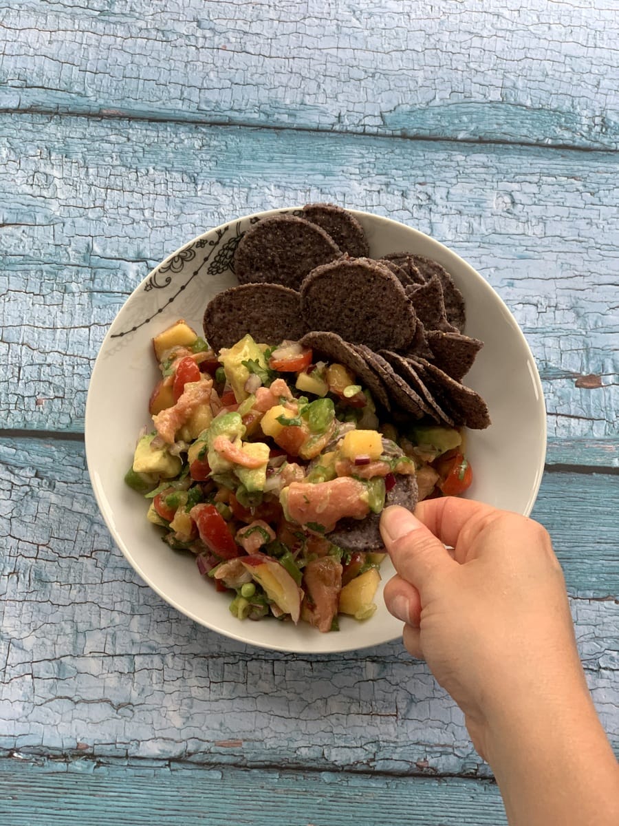 salmon ceviche action shot birdeye view